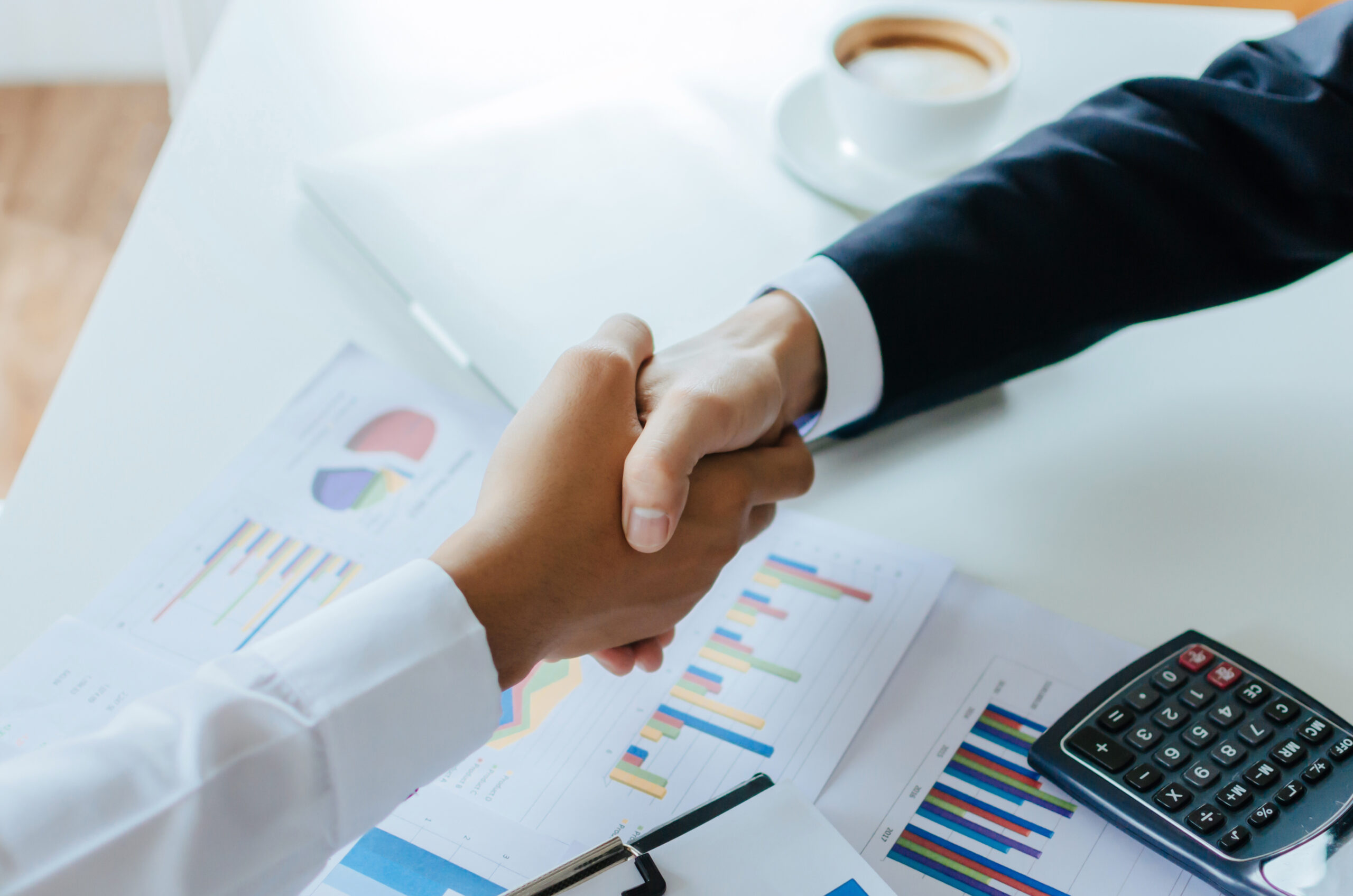 estate plan person people shaking hands over documents