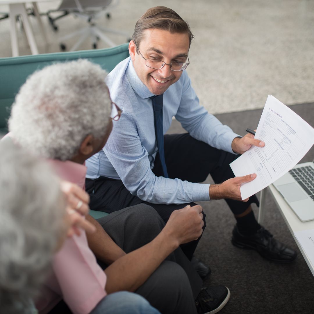 attorney showing papers to seniors