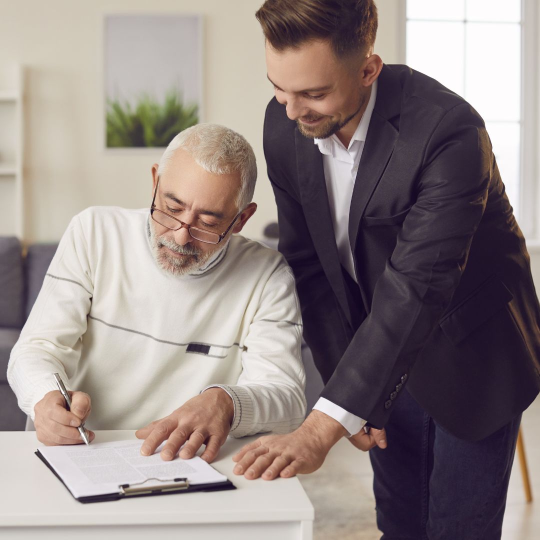 attorney helping senior with paperwork