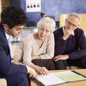 Lawyer reviewing options with elderly couple